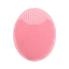 A pink silicone facial cleansing brush with multiple textured surfaces for deep pore exfoliation
