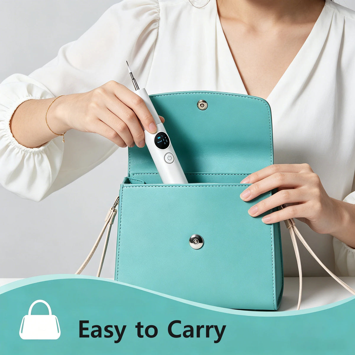A hand is using a white ultrasonic dental cleaning kit to open a teal-colored professional dental cleaning kit purse.