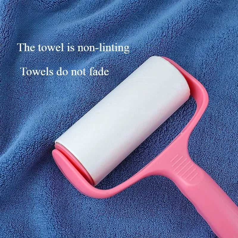 A pink towel holder is shown against a blue towel, with text stating the towels are non-linting and do not fade.