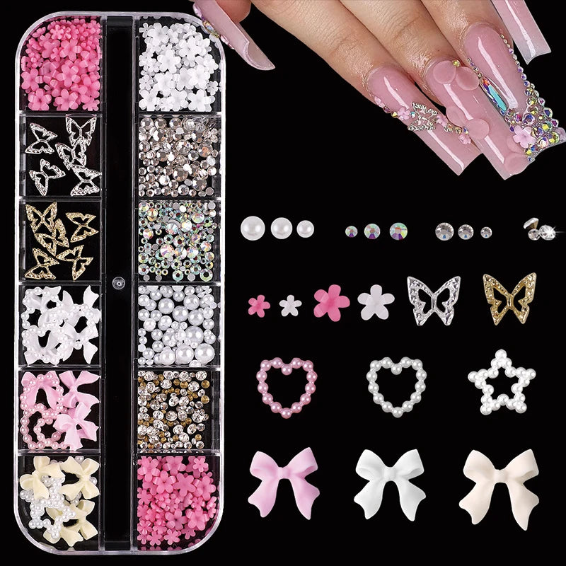 A collection of pink and white rhinestones, pearls, and charms for nail art decoration.