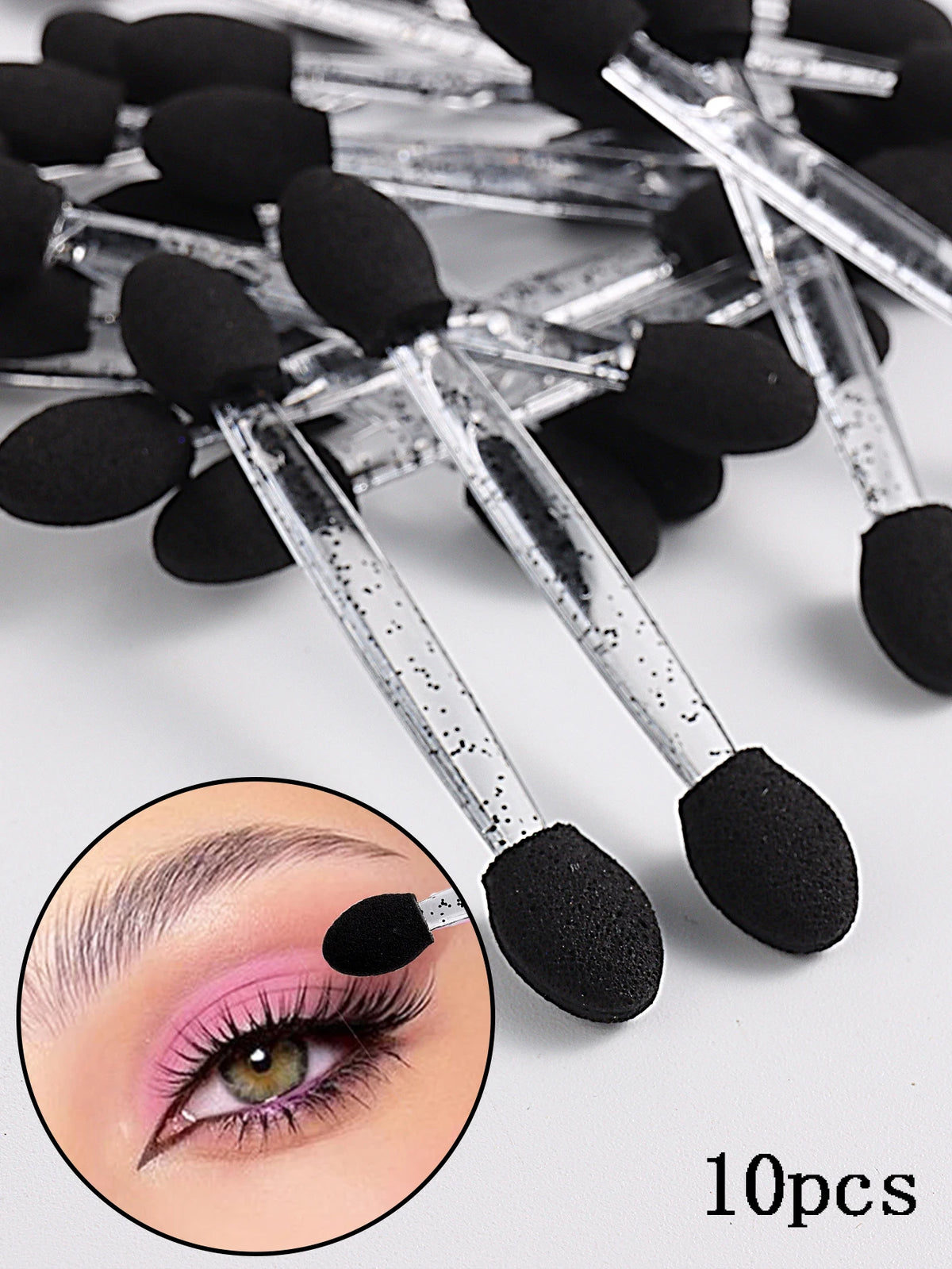 A set of 10 double-sided nail art brushes with sponge applicators shown next to an eye demonstrating their use.