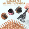 A black boar bristle hair brush is shown with various brushes and a wooden brush in a light background.