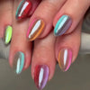 A close-up of ten press-on nails featuring various iridescent and holographic pink, purple, and green floral designs.