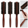 A set of brown natural boar bristle curling brushes shown from multiple angles.