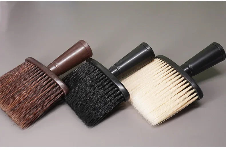 A set of three hair duster brushes with wooden and black handles and various bristle types.