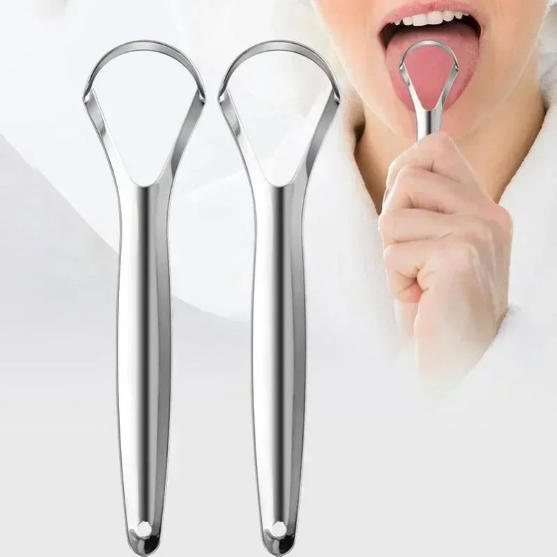 A person is using a reusable stainless steel tongue scraper for oral hygiene.