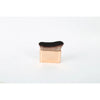 A rectangular gold-toned makeup brush with a dark brown, dense synthetic hair bristles.