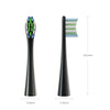 A black replacement brush head with green bristles and a light blue plastic cap, shown next to a measurement scale.