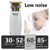 A white and gold cordless hair clipper trimmer device shown next to a baby sleeping peacefully.