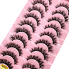 Un plateau rose de kits d'extensions de faux cils de renard 3D avec différents styles et longueurs.