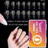 A hand holds a box of soft gel nail tips showing various sizes and shapes for acrylic nails.