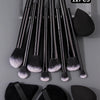 A set of 12 makeup brushes and tools including various shapes and sizes for applying cosmetics.