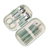 Stainless steel nail clipper set with storage in a light green case featuring various metal clippers and scissors.