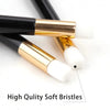 A close-up of a black and gold eyelash extension cleaning brush with high quality soft bristles.