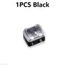 A single black dual pencil sharpener for cosmetics and art supplies.