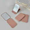 A portable pink PU leather makeup mirror is shown next to a white keyboard and another similar mirror.