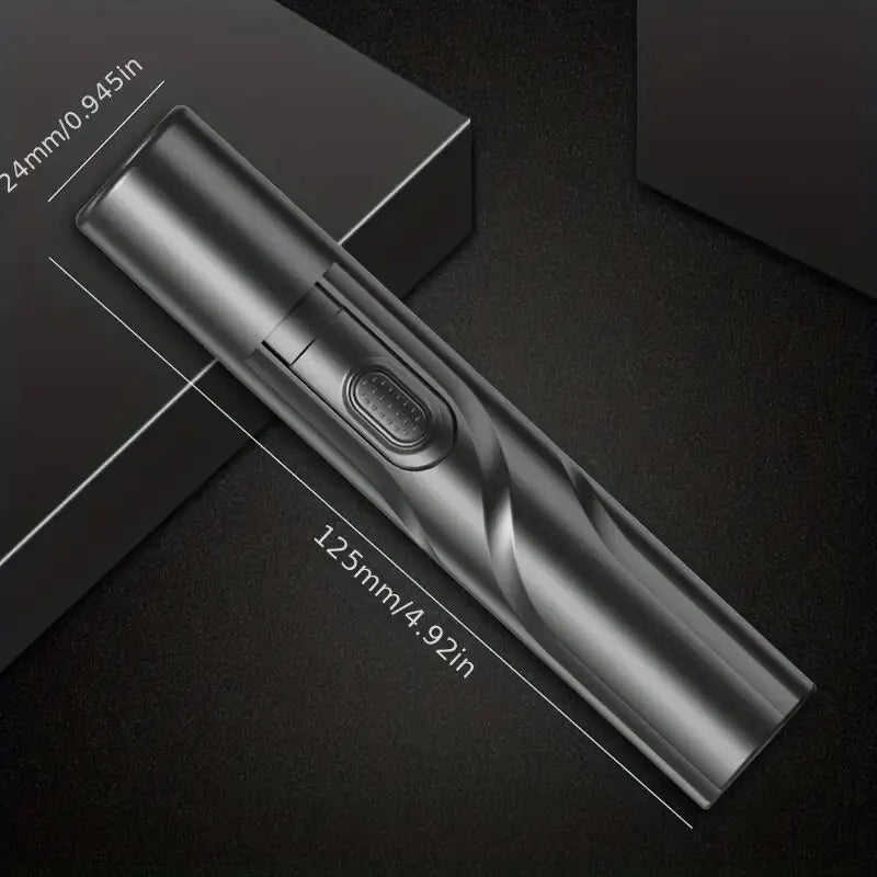A silver electric nose hair trimmer is shown diagonally on a dark surface with dimension markings.