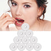 A woman is using mint flavored dental floss, with several rolls of the floss displayed below.