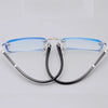 Pair of clear blue photochromic reading glasses with silver frames
