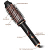 A black ceramic heated curling iron with a round brush and power switch is shown.