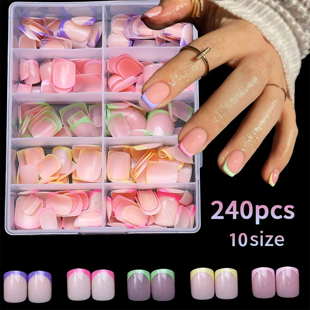 Une boîte de 240 ongles acryliques press-on roses et violets sur une main.