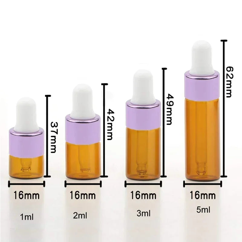 A set of five glass dropper bottles with purple and amber liquid for essential oils and samples, showing various volumes.