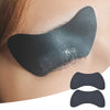A close-up of a reusable silicone lash lift shield eye pad applied to an eyelid.