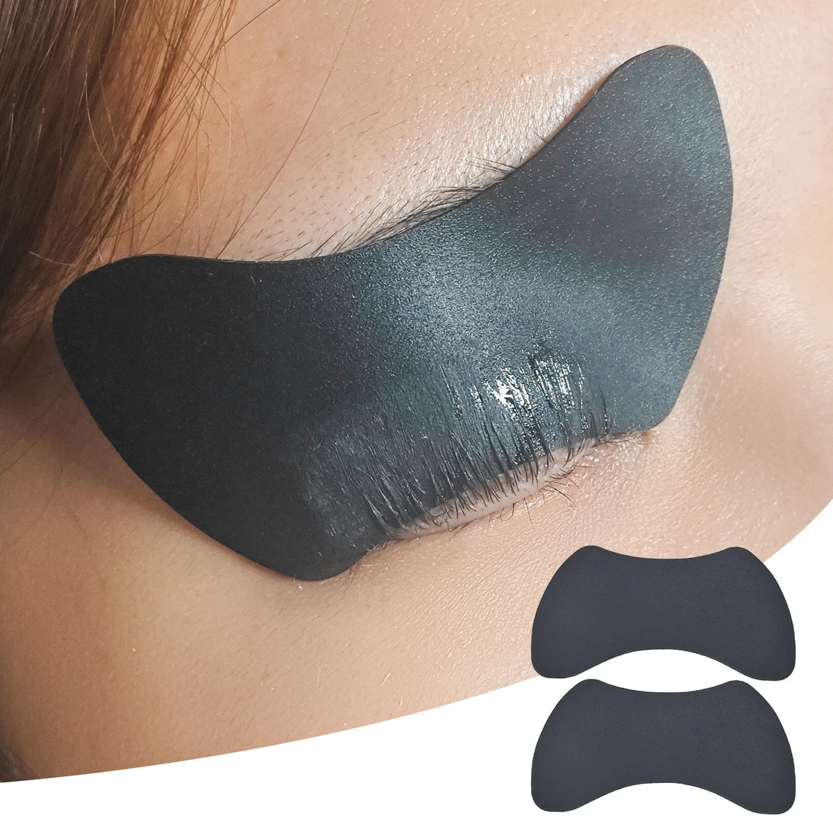 A close-up of a reusable silicone lash lift shield eye pad applied to an eyelid.