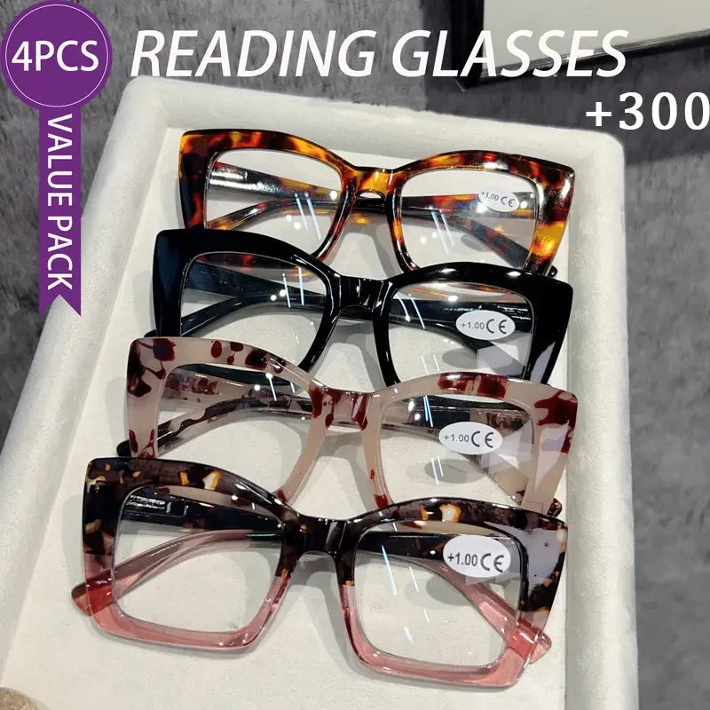 A value pack of four tortoiseshell reading glasses displayed in a white box.