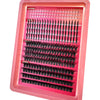 A pink plastic tray holding various clusters of black false eyelashes for DIY eyelash extensions.