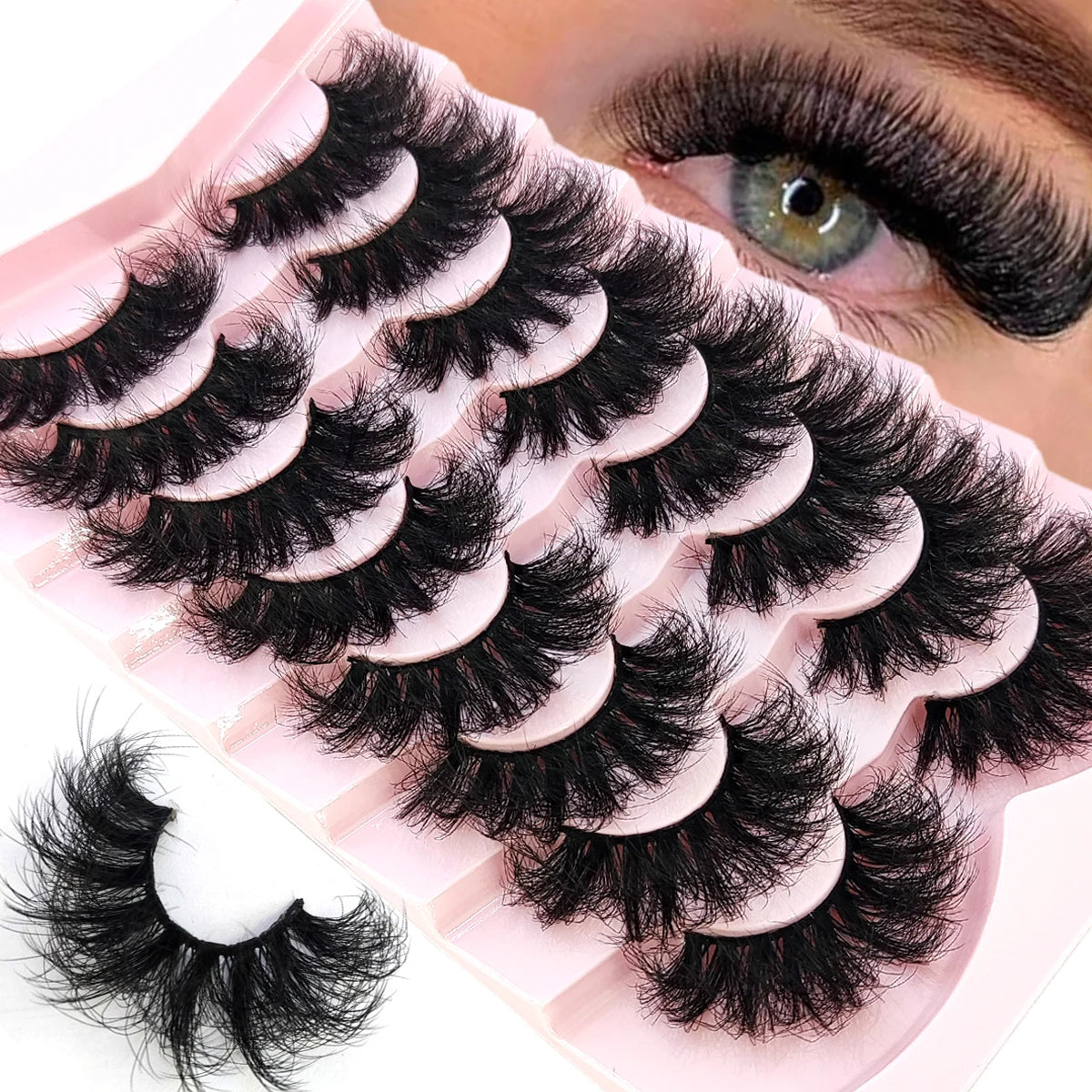 A close-up of natural mink striped false eyelash extensions applied to an eye.