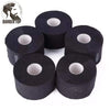 Several rolls of black disposable neck paper used for salon procedures