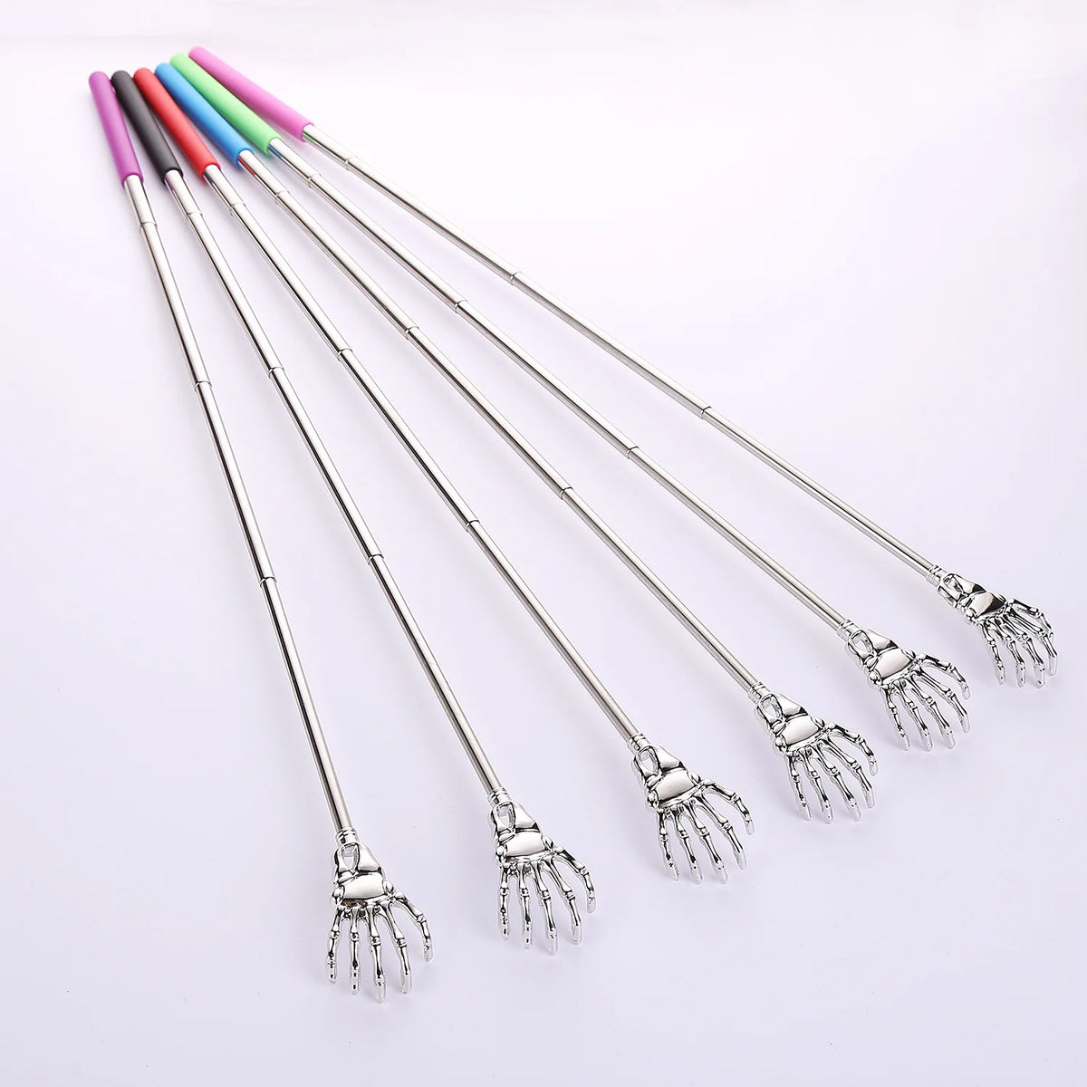 A set of five stainless steel telescopic back scratchers with colored handles arranged diagonally on a white background.