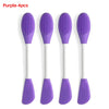 A set of four purple silicone facial brushes for exfoliation