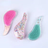 Un set de trois peignes pour cheveux en silicone rose et vert avec des animaux de dessins animés pour enfants et adultes.