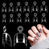 A set of medium clear almond acrylic nail tips displayed in various shapes and sizes on a black background.