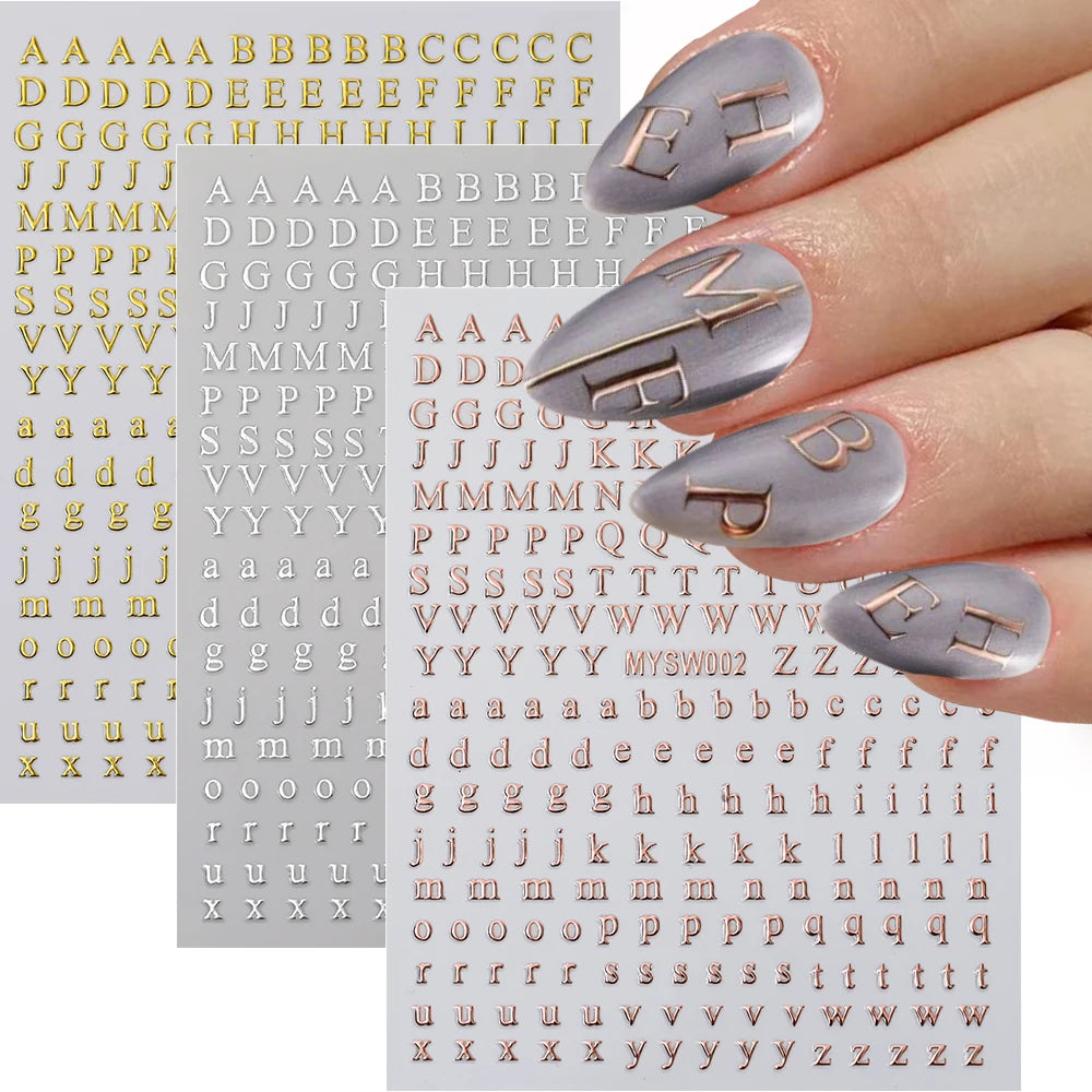 A collection of laser gold and silver 3D alphabet nail art stickers featuring various letters and symbols.
