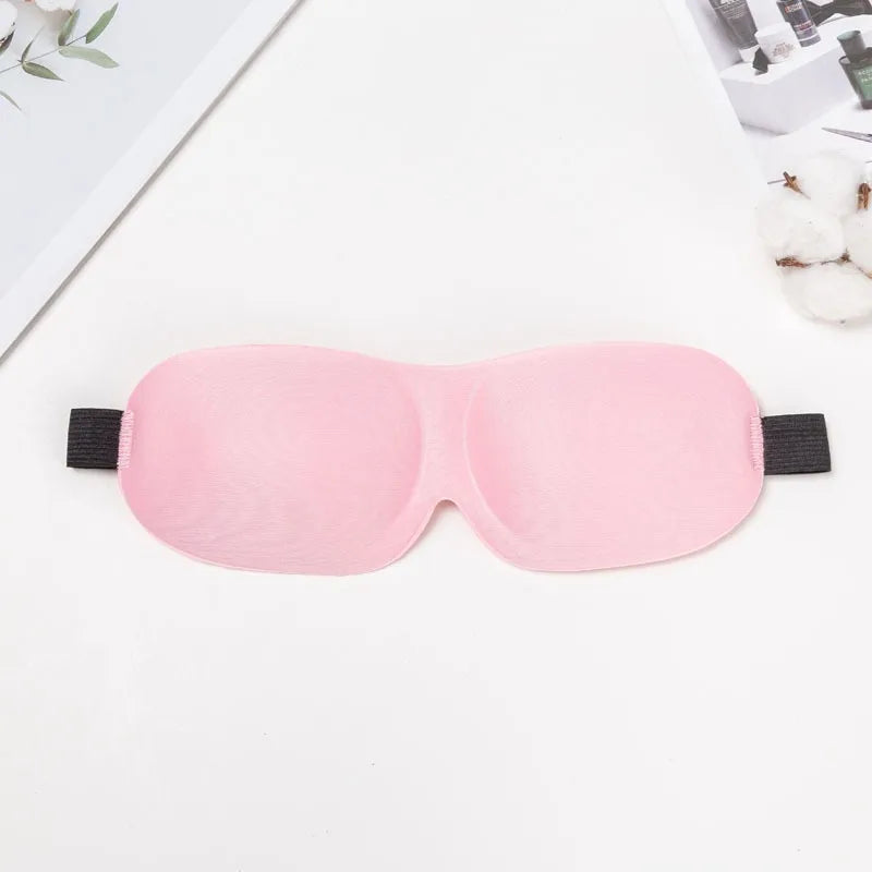 A pink comfortable 3D sleep mask designed for light blocking.