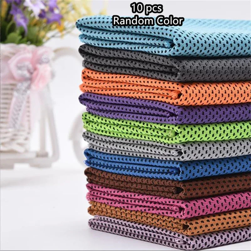 A stack of 10 patterned, colorful ultra soft quick-dry sport towels in various shades of blue, green, purple, and brown.
