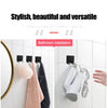 Porte-serviettes composable avec des porte-serviettes noirs et un support de rasoir blanc installé dans une salle de bain.