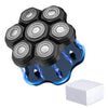 A black electric shaver head with multiple interchangeable circular shaving foils floating above a blue glowing surface.