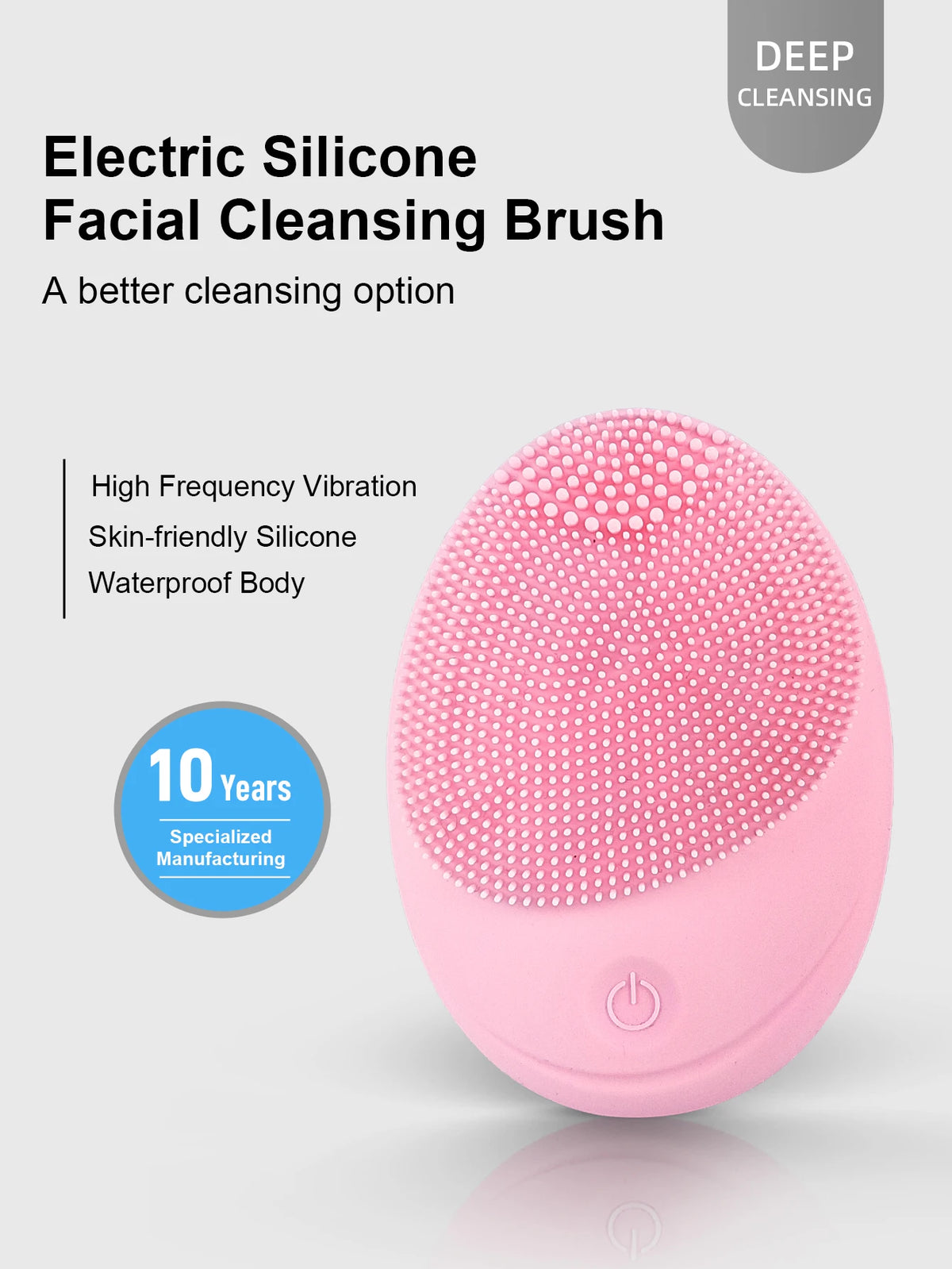 A pink electric silicone facial cleansing brush with a textured head and power switch.