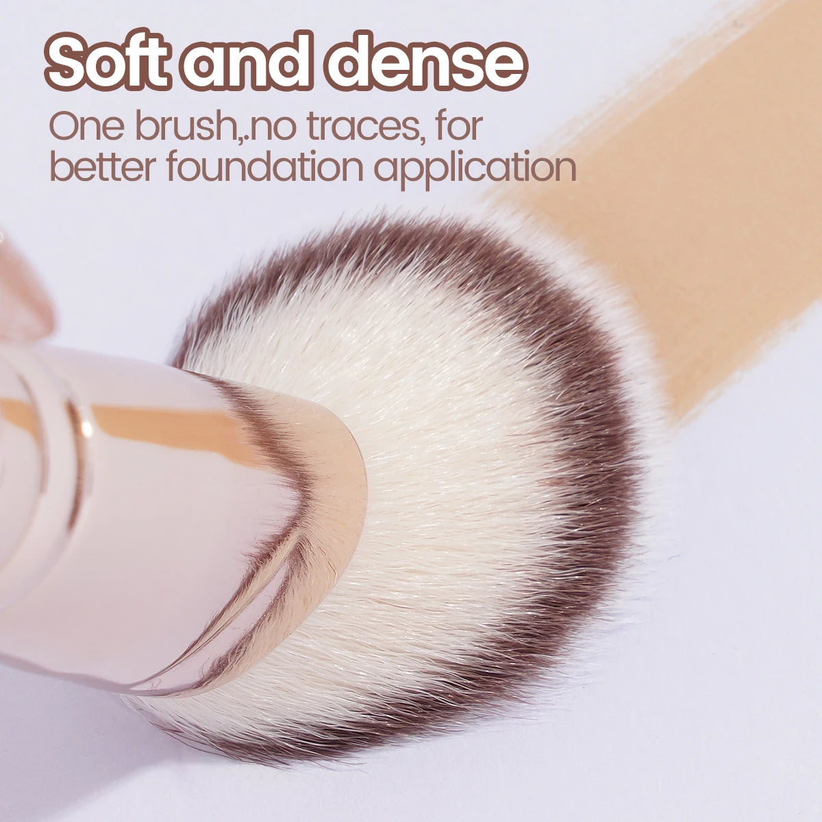 A close-up of a soft and dense makeup brush with light brown bristles used for foundation application.