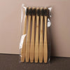A clear plastic package containing a set of six light brown bamboo toothbrushes.