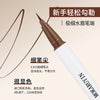 A close-up of a cosmetic product featuring a fine tip applicator for eyebrow tinting cream.