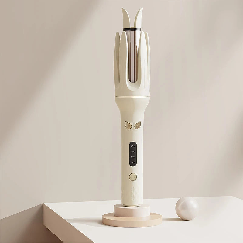 A white automatic ceramic hair curler with negative ions is displayed on a light surface.