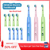Set of 4 children electric toothbrushes with various brush heads and cartoon designs in green and pink.