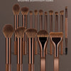A collection of 15 pieces of brushed aluminum makeup brush sets displayed against a dark background.