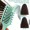 A teal styling brush is shown demonstrating the notch design for easy curling of dark hair, comparing before and after result