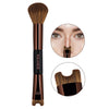 A brown double-ended contouring makeup brush with a synthetic hair bristles and a metal applicator tip.